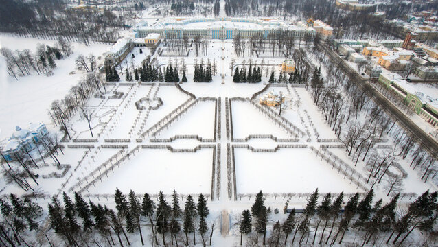 Aerial view of Catherine's Palace surrounded by a snowy landscape and elegant gardens, Pushkin, Russia.