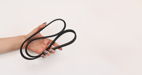 Fototapeta premium the generator belt is in your hand. car parts