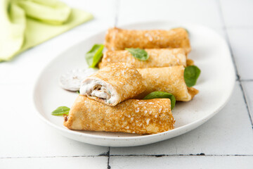 Crepes with creamy filling and raisins