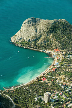 Aerial view of beautiful turquoise bay surrounded by cliffs and mountains, Novyi Svit, Russia.