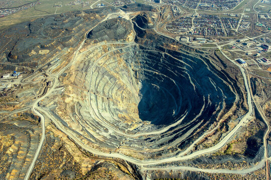 Aerial view of a beautiful mining cave and open pit quarry with intricate patterns and forms, Sibay, Bashkortostan Republic, Russia.