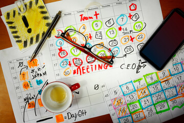 Calendar with business appointments,smart phone,pen and spectacles, monthly schedule. Business...