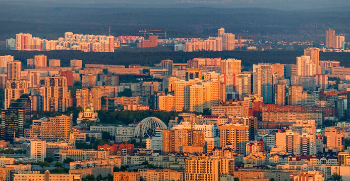 Aerial view of a vibrant urban landscape with modern skyscrapers and bustling streets, Ekaterinburg, Russia.
