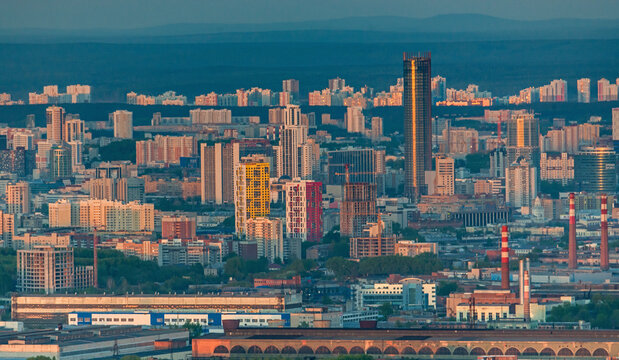 Aerial view of vibrant cityscape with modern skyscrapers and bustling downtown, Ekaterinburg, Russia.