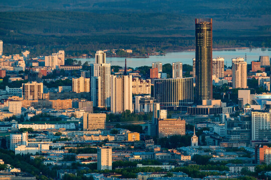 Aerial view of a vibrant urban cityscape with modern skyscrapers and bustling city life, Ekaterinburg, Russia.