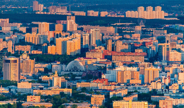 Aerial view of beautiful cityscape with modern highrise buildings and sunset glow, Ekaterinburg, Russia.