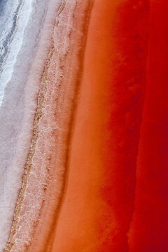 Aerial view of colorful salt lake elton with vibrant patterns and textures, volgograd oblast, russia.