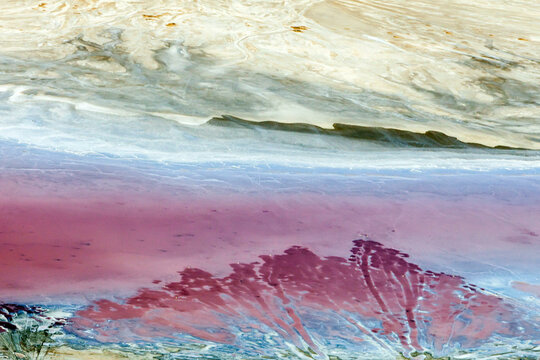 Aerial view of the colorful and vibrant salt lake Elton with unique patterns and reflections, Volgograd Oblast, Russia.