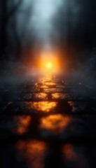 Fototapeta premium A foggy path illuminated by a soft orange glow, creating an atmospheric and mysterious vibe.