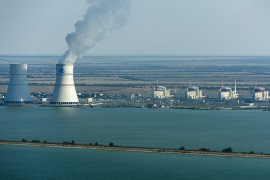 Russia - 06 June 2018: Aerial view of rostov nuclear power plant with cooling towers and smoke, Volgograd oblast, Russia.