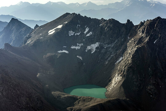Aerial view of majestic Mount East Dagger with a scenic snowy peak and rugged landscape, Kabardino Balkaria, Russia.