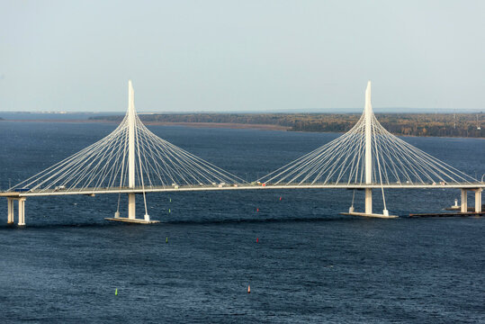 Aerial view of the cable stayed bridge over the mouth of the Little Neva with scenic urban landscape, Saint Petersburg, Russia.