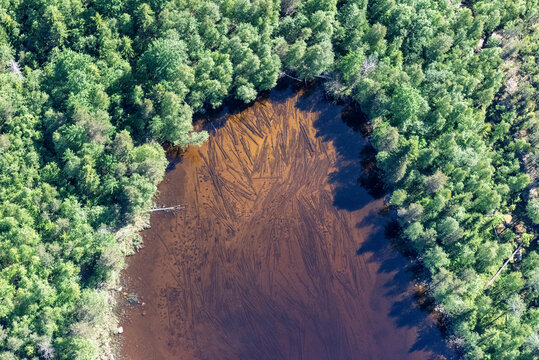 Aerial view of serene Lake Onega surrounded by lush forests and tranquil waters, Karelia Republic, Russia.