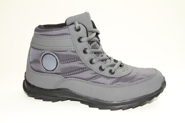 Men's sneakers. White background. Side view. Unbranded shoe model.