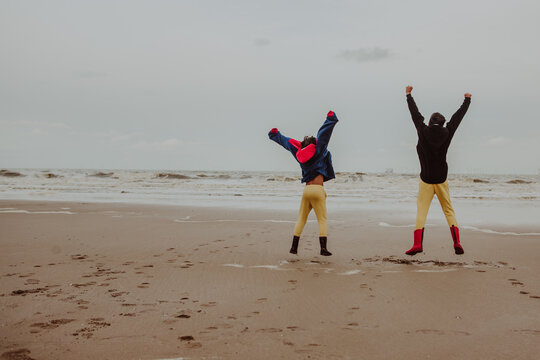 Kids enjoying and exploring a beach in north of Wales