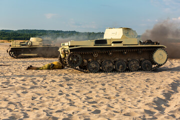 Fototapeta premium Two German tanks on the battlefield in the sand, dust and smoke.. Reconstruction siege of Tobruk durind WWII. Błędów desert, Silesia, Poland