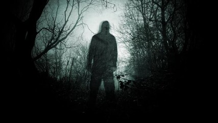 A double exposure of a hooded figure with a spooky horror figure blurred, standing in a forest on a creepy winters day.