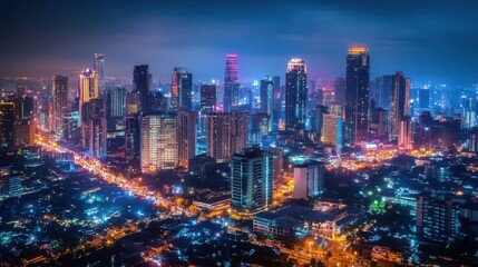 Obraz premium A bustling cityscape at night, skyscrapers illuminated by thousands of lights