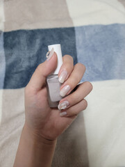 Gray nail art with heart parts on it