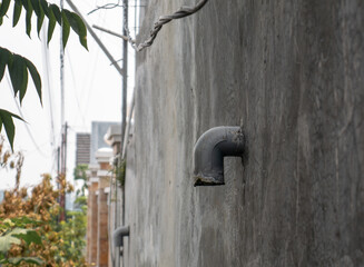 a pipe that comes out of the wall is used for drainage
