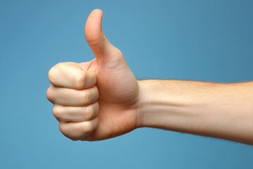 A hand is raised with the thumb extended upward, signaling approval and positivity. The backdrop is a clean blue, enhancing the gestures encouraging nature.
