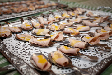 These delightful, bitesized appetizers are elegantly presented on decorative spoons, adding charm to any event