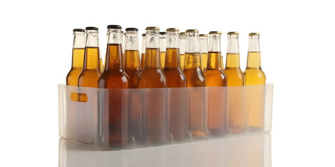 A set of amber-colored glass beer bottles in a transparent plastic tray with minimalistic background	