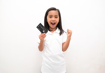 portrait of little girl holding credit card isolated white background