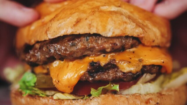 Juicy beef burger with tomatoes, melted cheese, Delicious juicy burger. High quality 4k footage