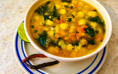 Meal in the restaurant plate with chickpeas dish soup.