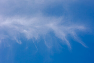 Beautiful white puffy cloud in strange shaped floating in blue sky, Cirrus clouds are short,...