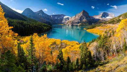 Fototapeta premium Breathtaking view of a serene lake surrounded by vibrant autumn foliage and majestic mountains under a clear blue sky. Perfect for nature and travel inspiration.