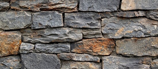 Fototapeta premium A Closeup Shot Of A Stone Wall Good For Background