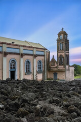 La Reunion, the Notre-Dame-des-Laves church in the village of Sainte-Rose, with the lava around, in the east coast of the island
