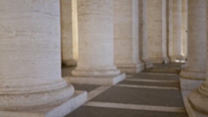 Defocused columns of iconic architecture with soft light and shadow in vatican city, italy,...