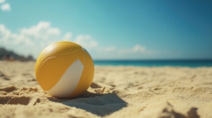 Obraz premium Beach volleyball ball resting on the sand popular summer sport trend