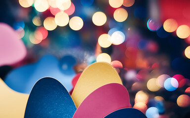 Abstract colorful shapes with a blurred background of festive lights  perfect for a holiday or celebration design   