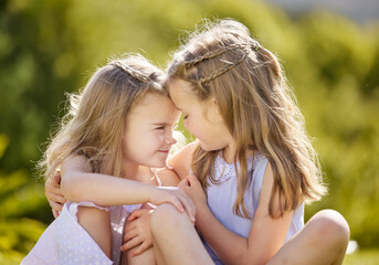 Girl, sisters and hug with care in garden with smile, love and playful in sunshine on holiday. Kids, siblings and happy with embrace, connection and bonding in backyard, nature or outdoor in Germany