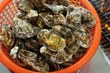 Korean seafood food. Fresh oysters in a basket