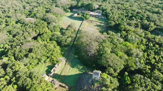 Aerial view of ancient maya ruins surrounded by lush forest and greenery, Labna, Yucatan, Mexico.