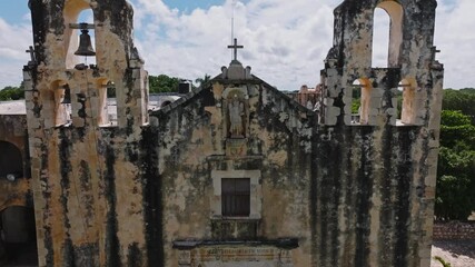 Aerial view of the historical convent of San Miguel with its bell tower and cross, Mani, Mexico.