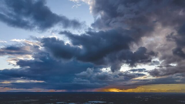 Dramatic timelapse scene of clouds moving in the sky at sunset
