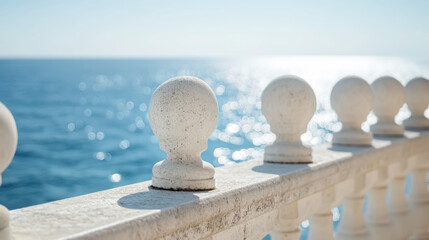 Tranquil seaside view from white stone balustrade for coastal design and decor inspiration