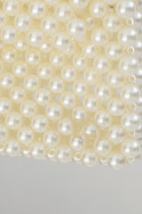 A close-up of white perlins carefully placed on the area creating a unique piece.