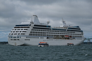 Small luxury cruiseship cruise ship liner Nautica anchoring at sea in bay of Newport, Rhode Island...