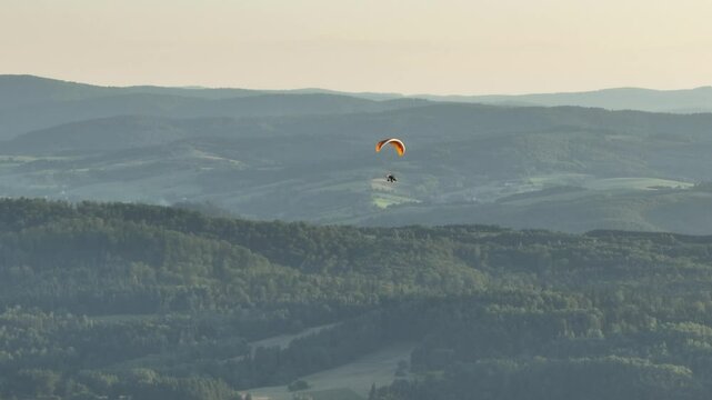 Paraglider against the background of mountains. Mavic 3