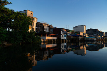 People's houses along the Bang Nara River Narathiwat Province, Thailand.