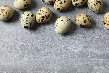 Quail eggs on gray background