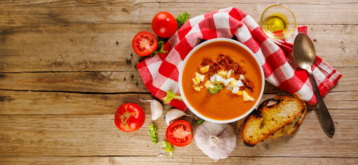 typical spanish salmorejo with ham and egg