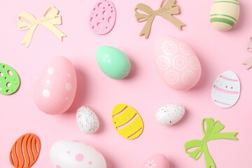 Happy Easter card. Easter eggs and decoration on color background, top view